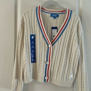 Cream cardigan with red and blue trim